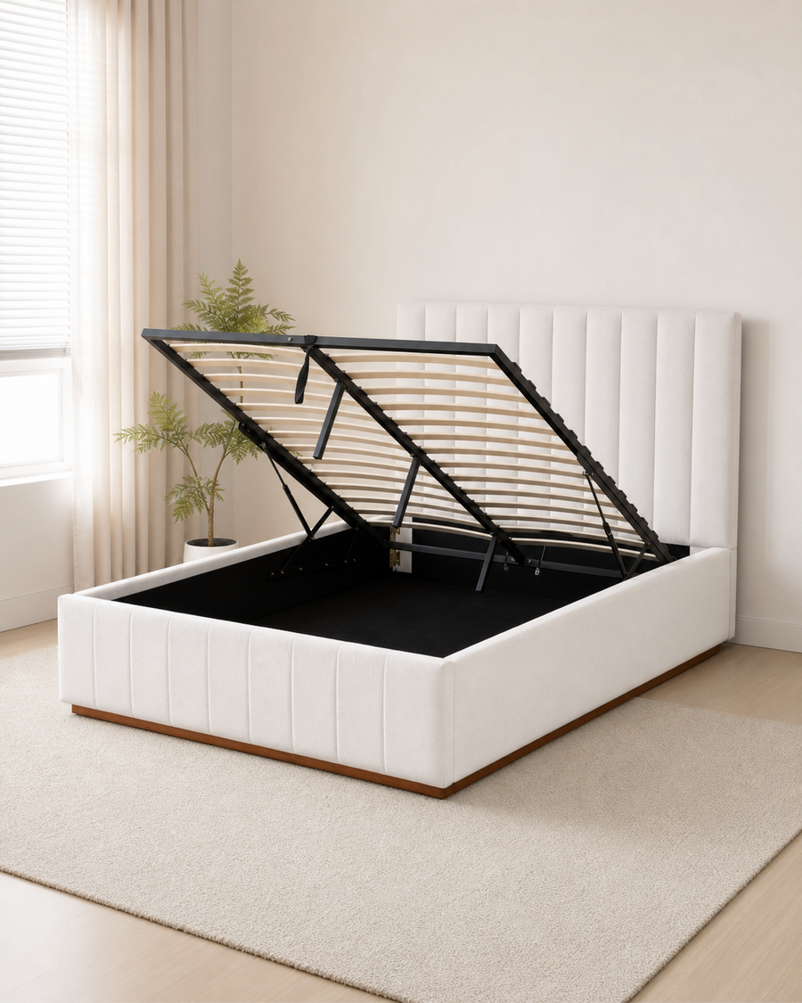 Upholstered gas-lift bed frame open to show under-bed storage