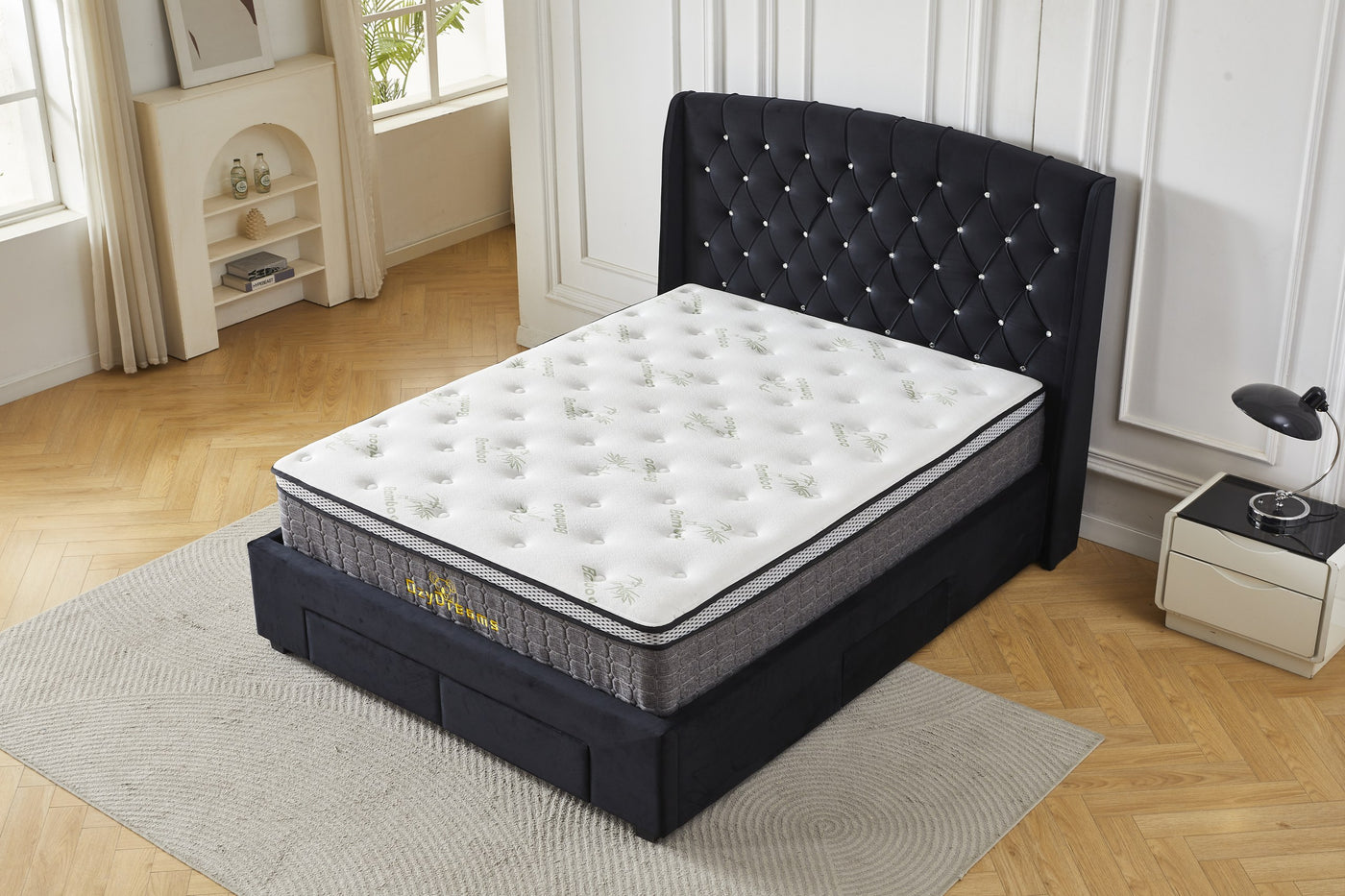 Black tufted four-drawer bed frame and bamboo mattress package, elevated front view
