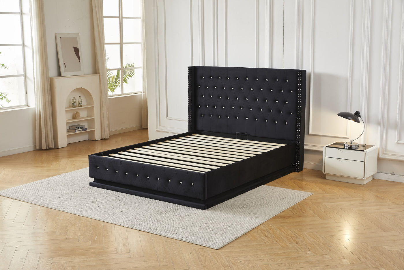 Black crystal tufted gas lift storage bed frame, angled front view