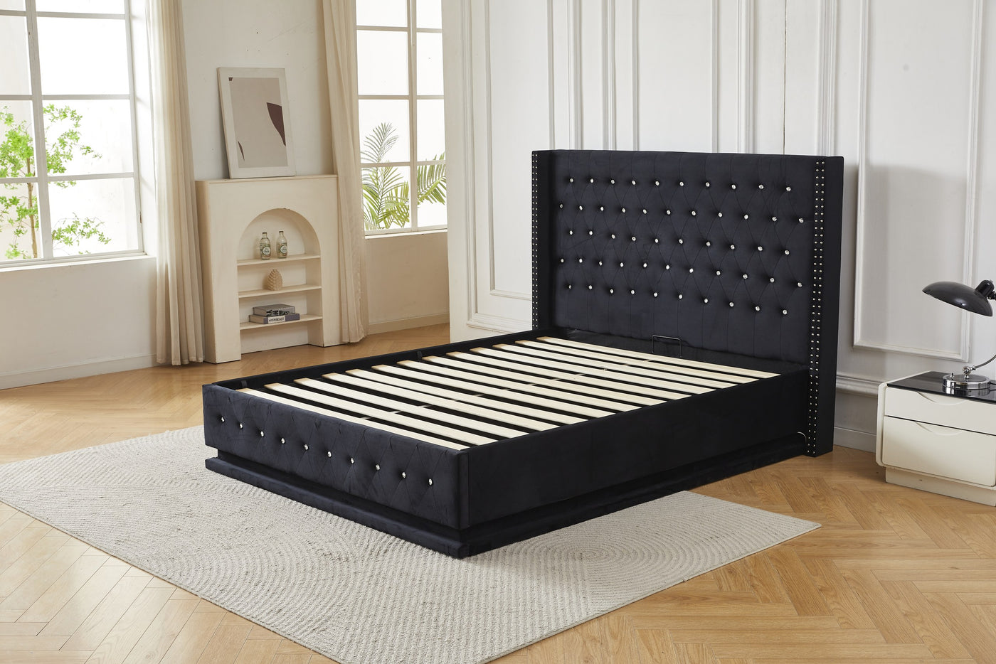 Black crystal tufted gas lift storage bed frame with LED base lighting, angled view