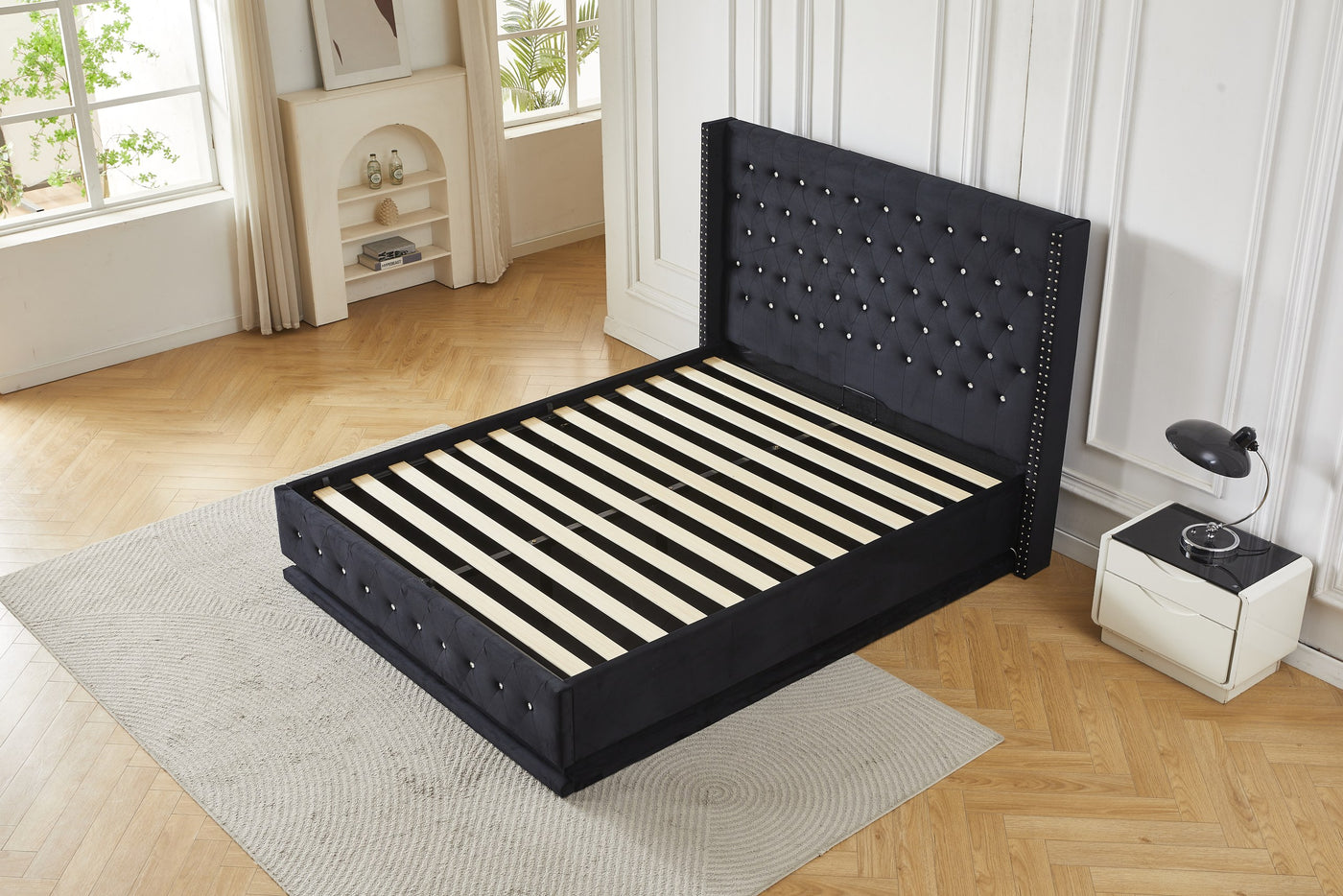 Black crystal tufted gas lift storage bed frame with gas lift storage base open, angled view