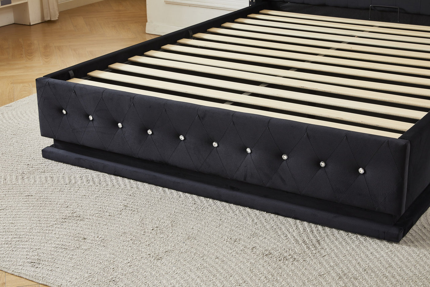 Black upholstered bed frame footboard with crystal button detailing