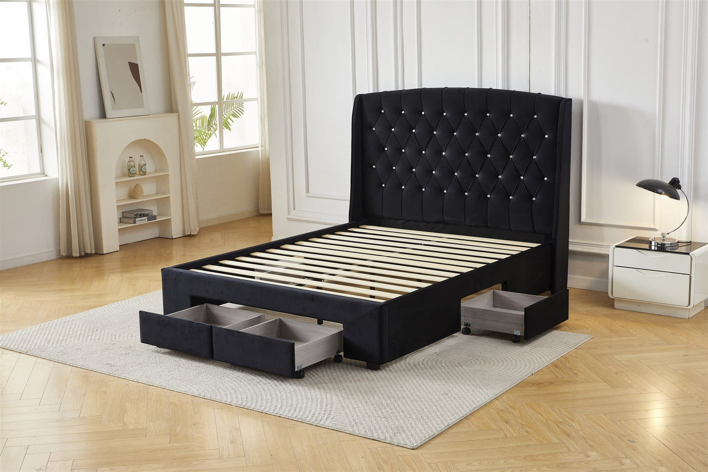 Black tufted bed frame with drawers open, angled view