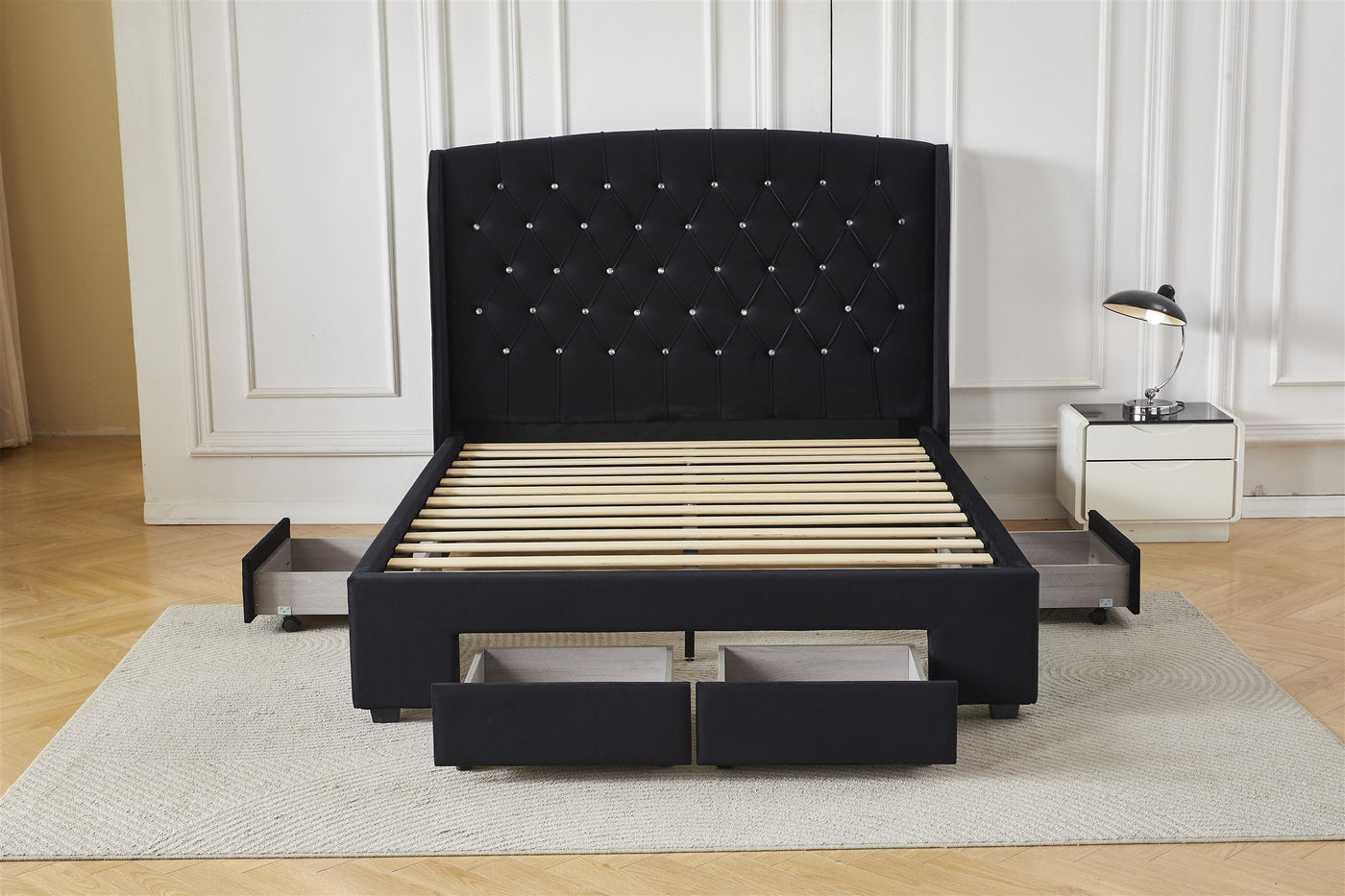 Black tufted bed frame with four drawers open