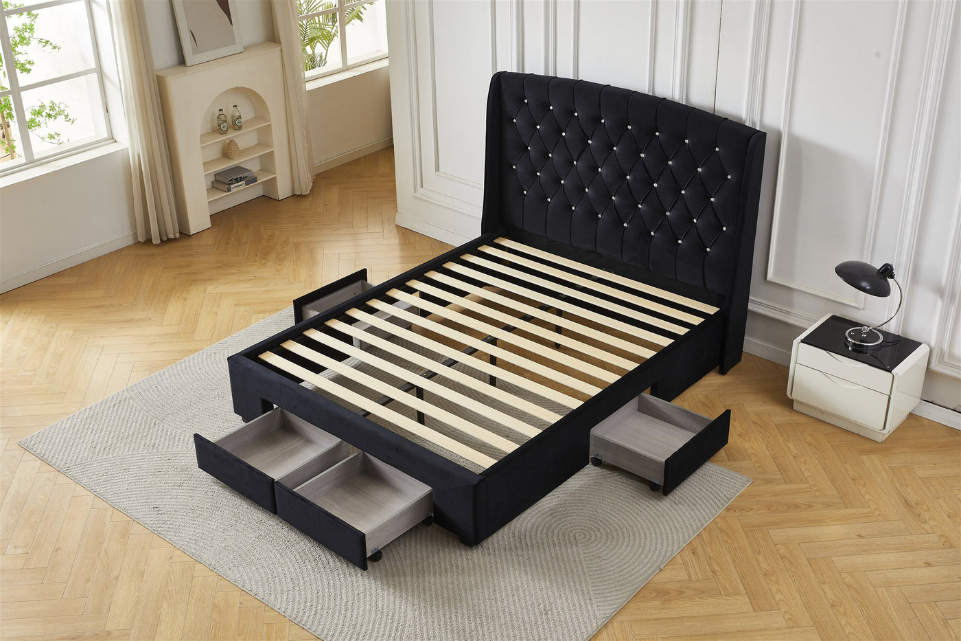 Black tufted bed frame with drawer storage, angled view