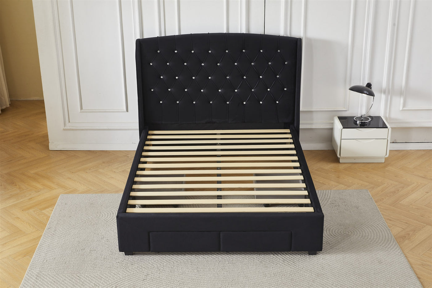 Black tufted bed frame without mattress