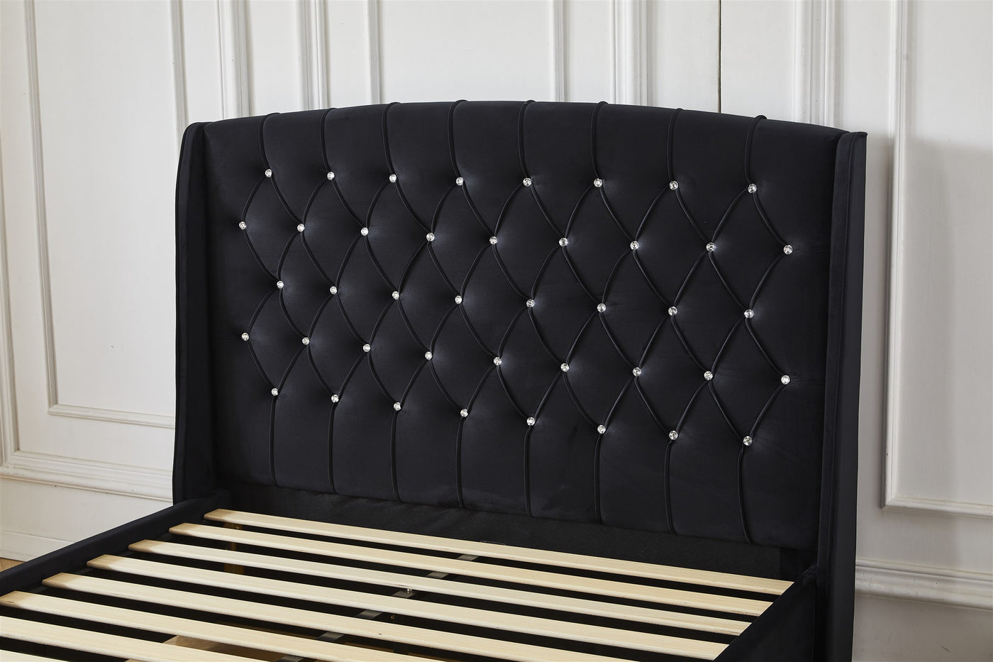 Black tufted crystal button headboard detail