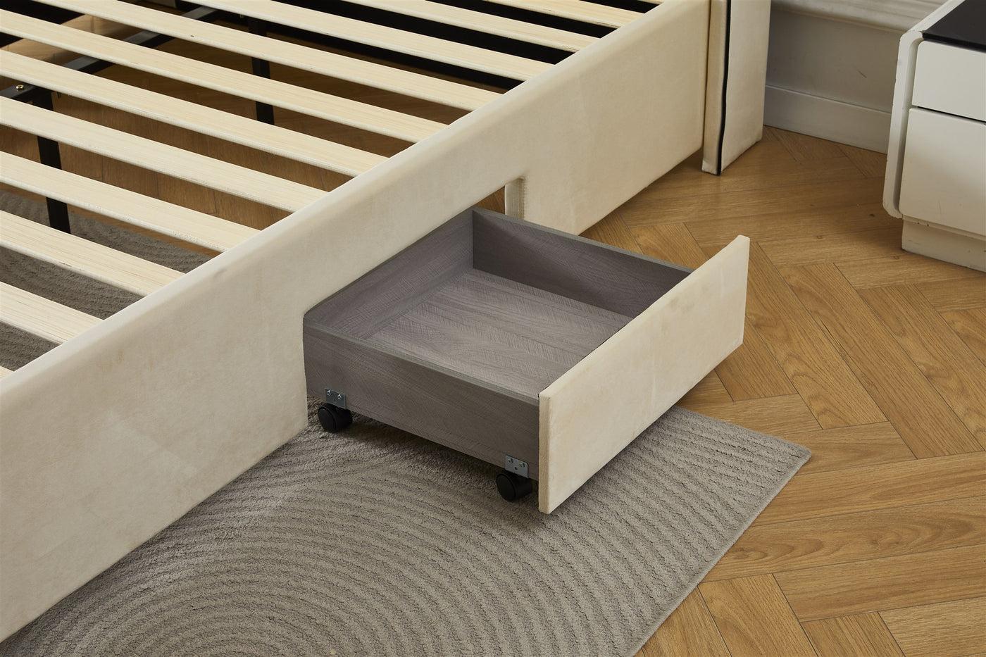 Cream bed frame drawer storage detail