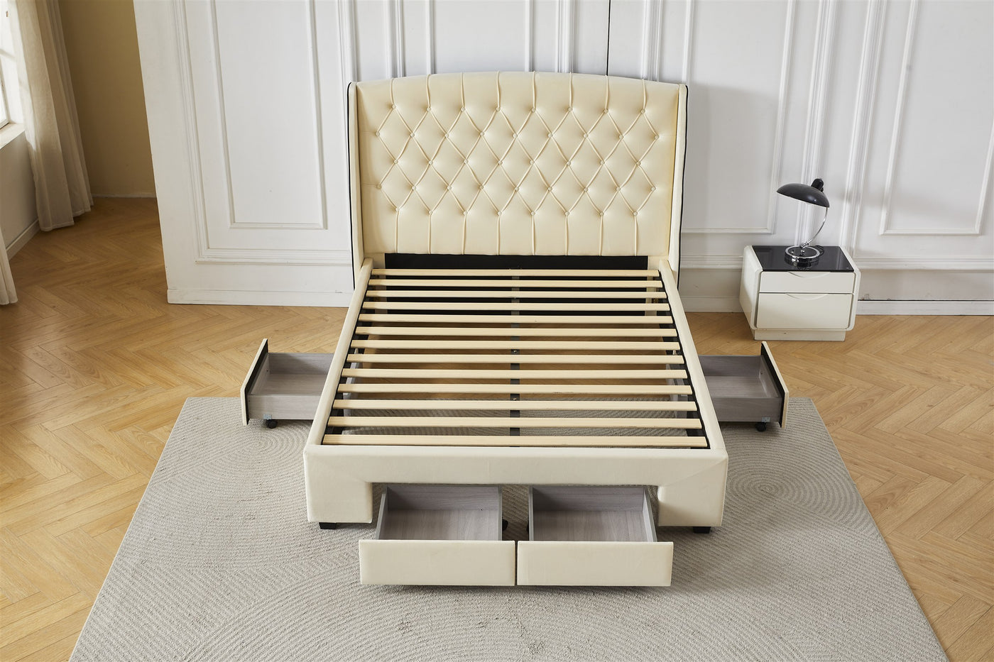 Cream tufted bed frame with front and side drawers open