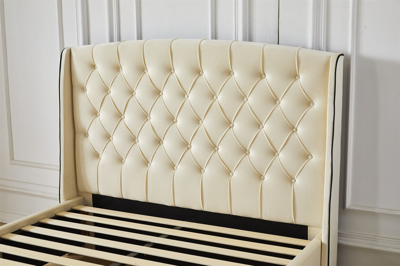 Cream tufted button headboard detail
